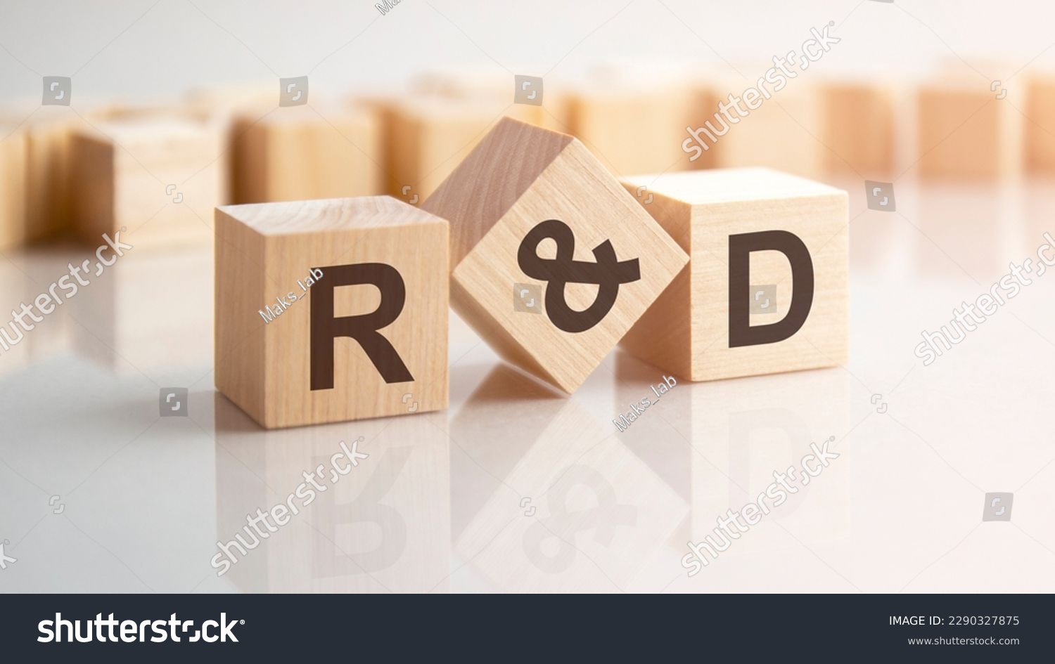 word R and D made with wood building blocks, stock image. background may have blur effect #2290327875
