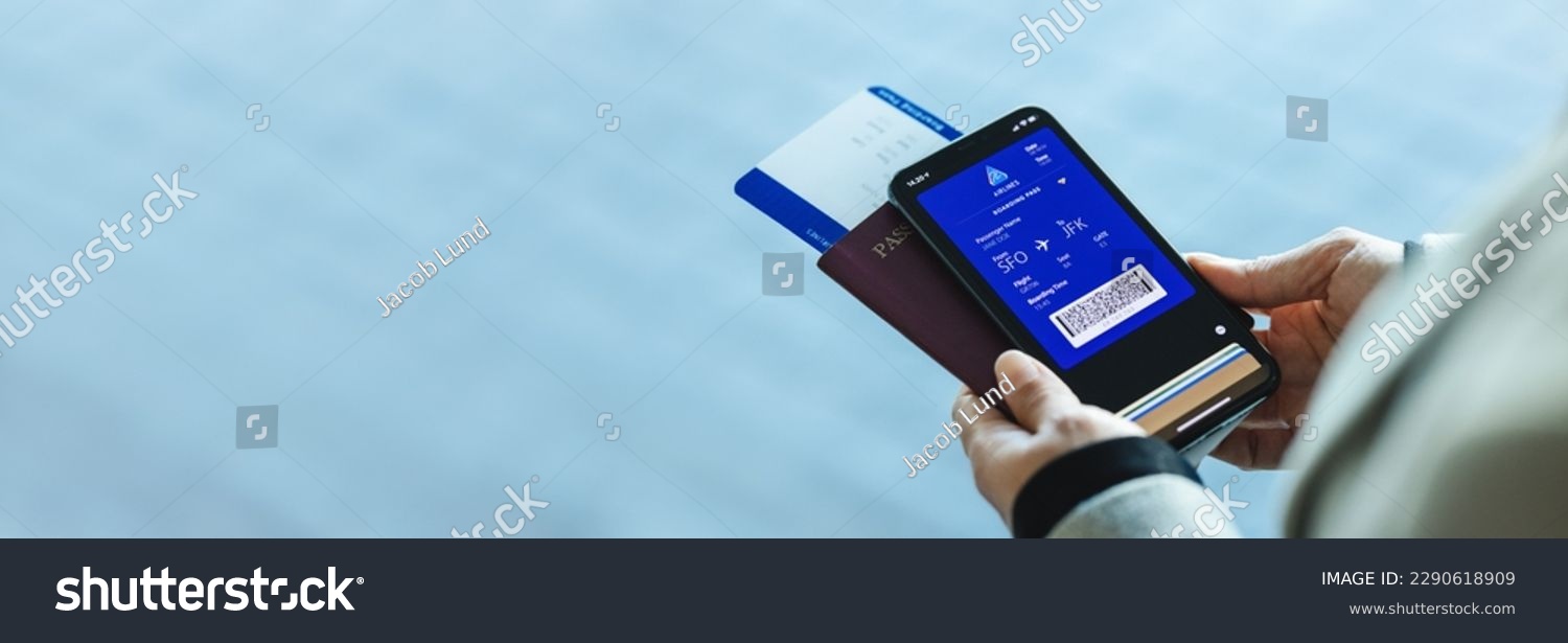 Closeup of a woman with electronic boarding pass on phone with passport and flight ticket at airport. Digital airplane ticket on the smartphone mobile app. #2290618909