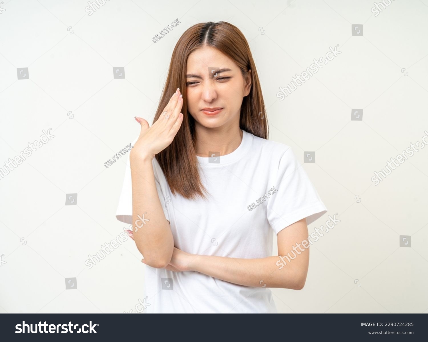 Bad smell stinks. Young beautiful asian woman pinching nose with disgust. Holding breath with fingers on nose #2290724285