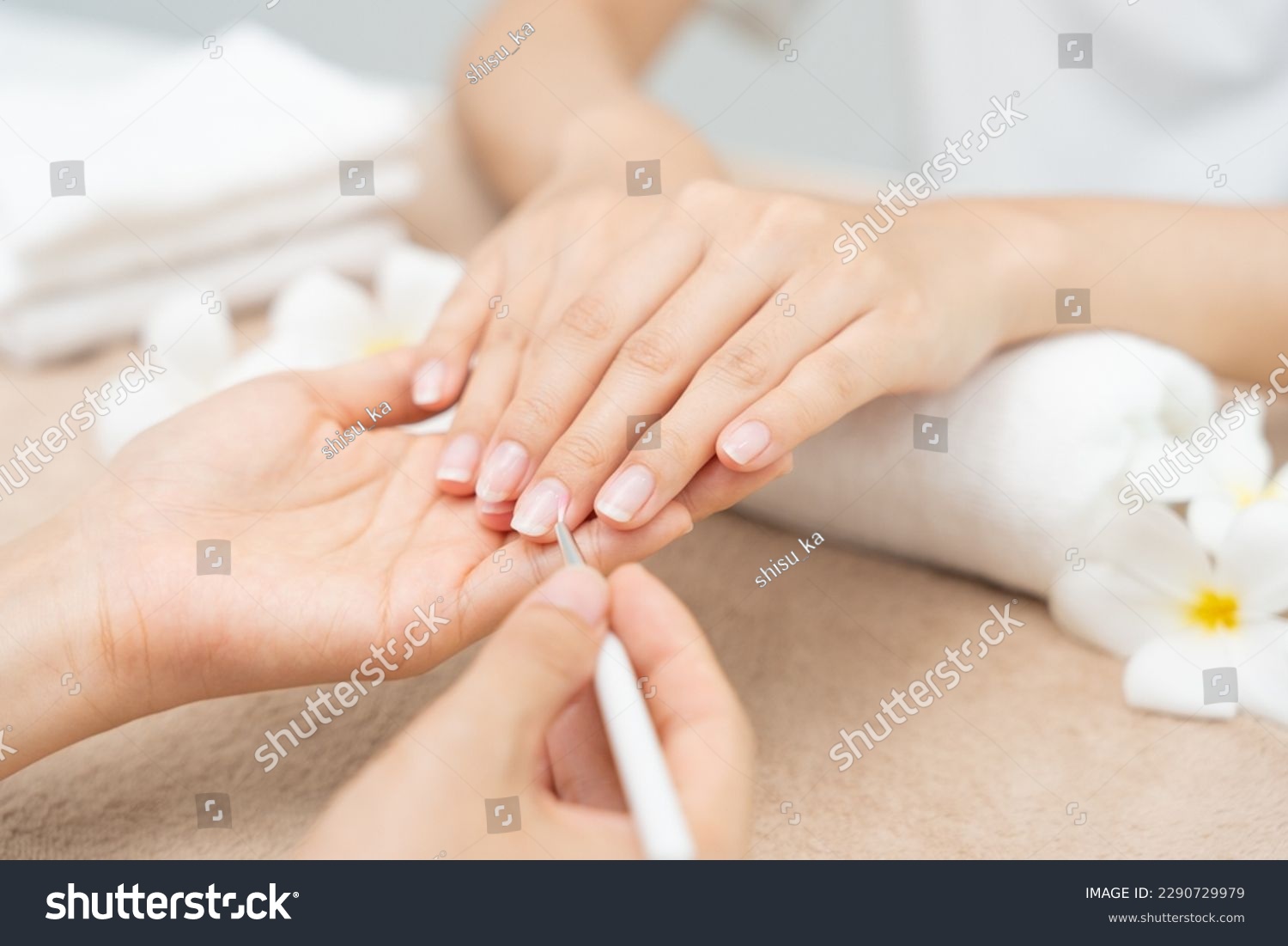 Woman receive care service by professional Beautician Manicure at spa centre. Nail beauty salon use nail file for Glazing treatment. manicurist make nail customer to beautiful. body care spa treatment #2290729979