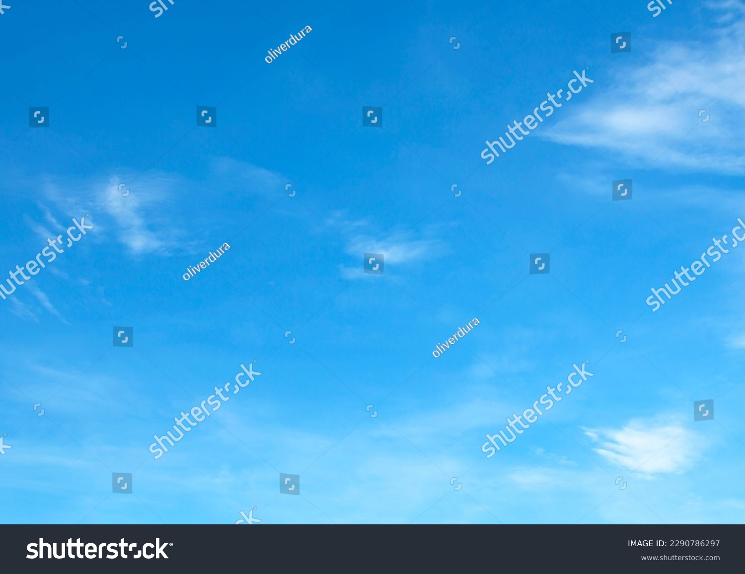 blue sky background with tiny clouds #2290786297