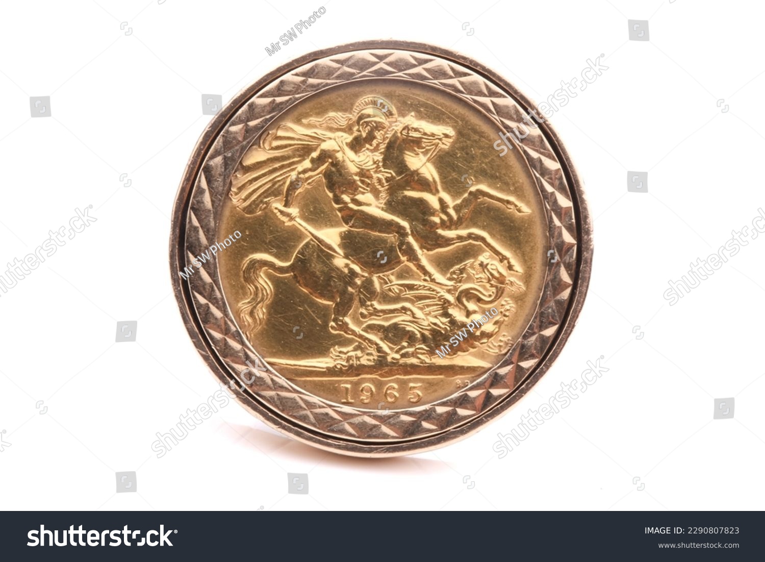 A chunky and heavy gold ring with a gold sovereign coin mounted in it. Isolated on White. #2290807823