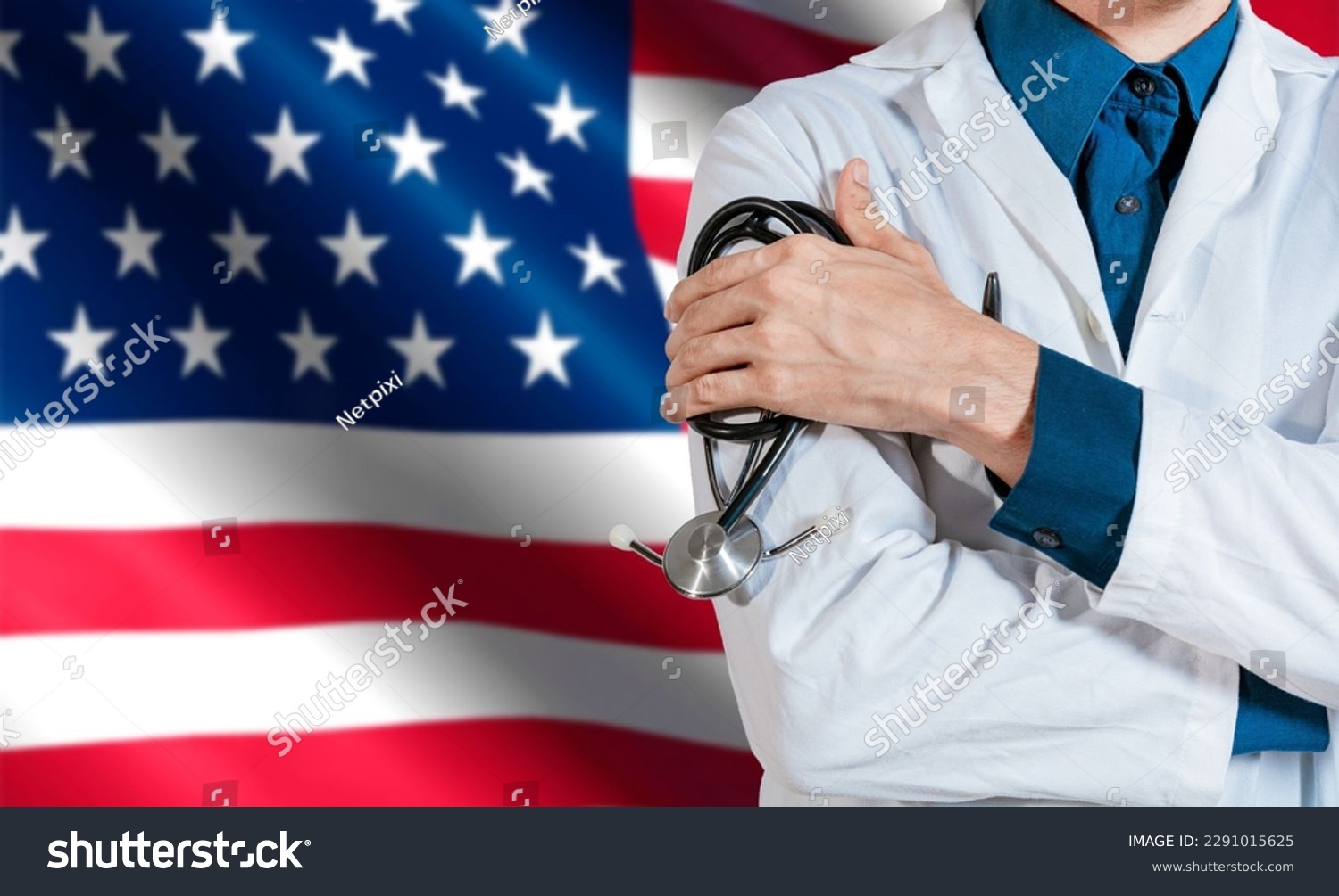 Doctor with stethoscope on USA flag. Health and care with the flag of United State. USA national health concept, Doctor arm holding stethoscope on USA flag #2291015625