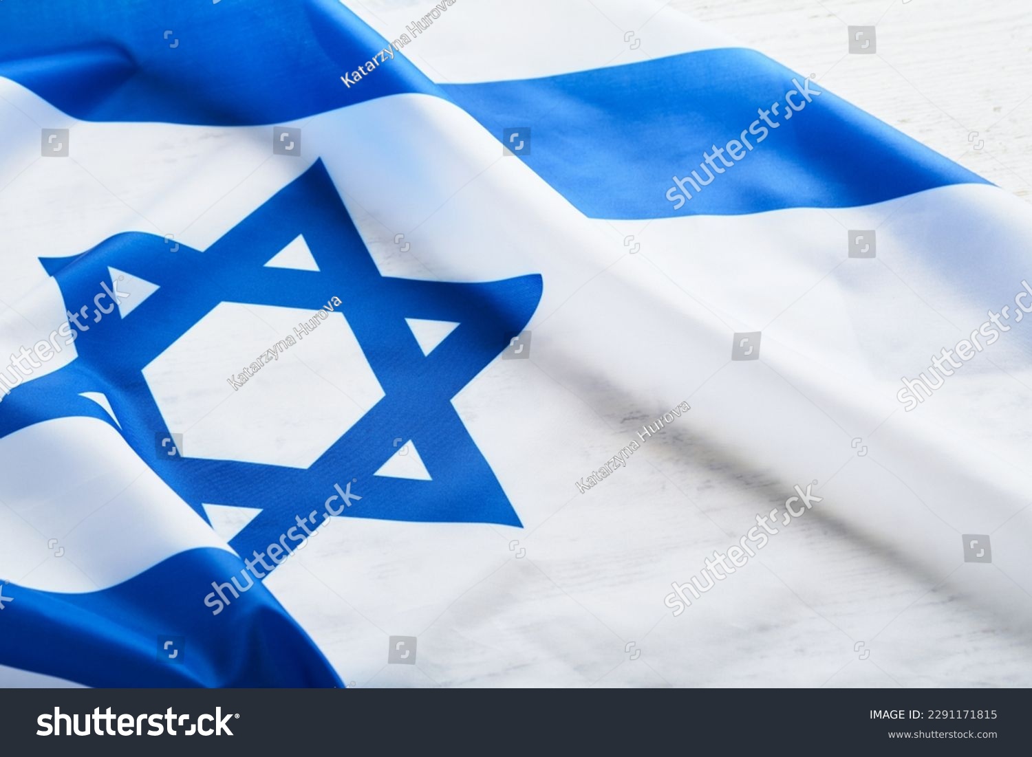 Independence Day of Israel. National Israel flag with star of David over white wooden background. Close up. National flag with place for text. #2291171815
