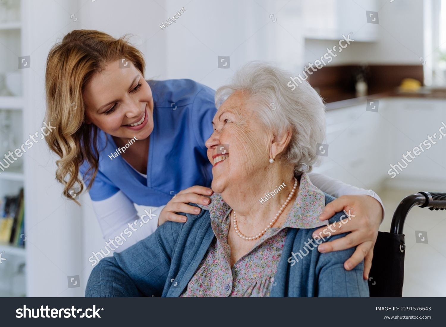 Portrait of nurse and her senior client on wheelchair. #2291576643