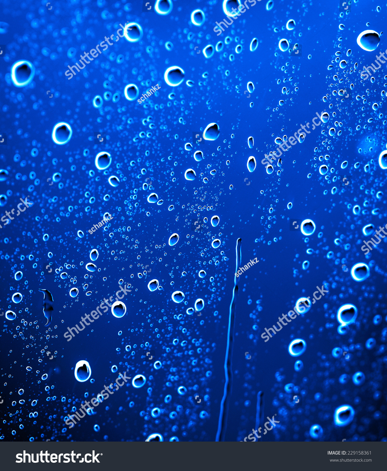 fresh background of water drops on blue surface #229158361