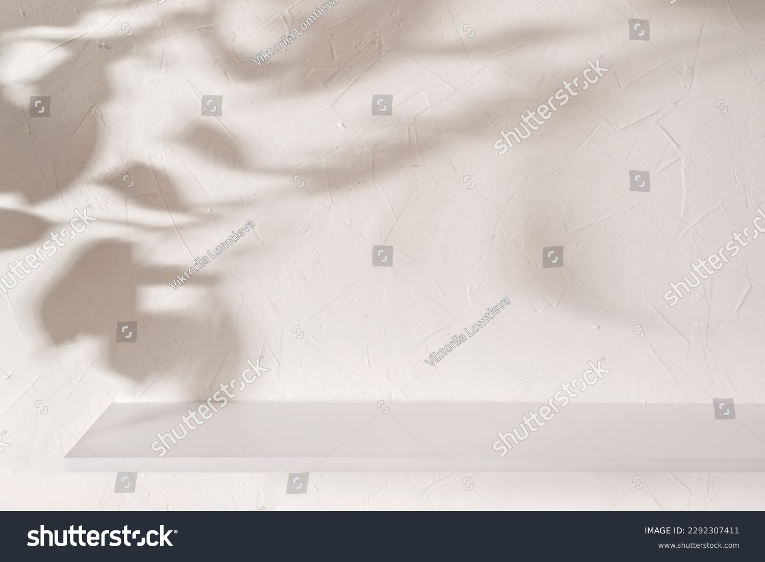 Empty shelf on a beige textured plaster wall background with aesthetic floral sun light shadows, product stand or podium design template for business branding advertisement, mockup with copy space #2292307411