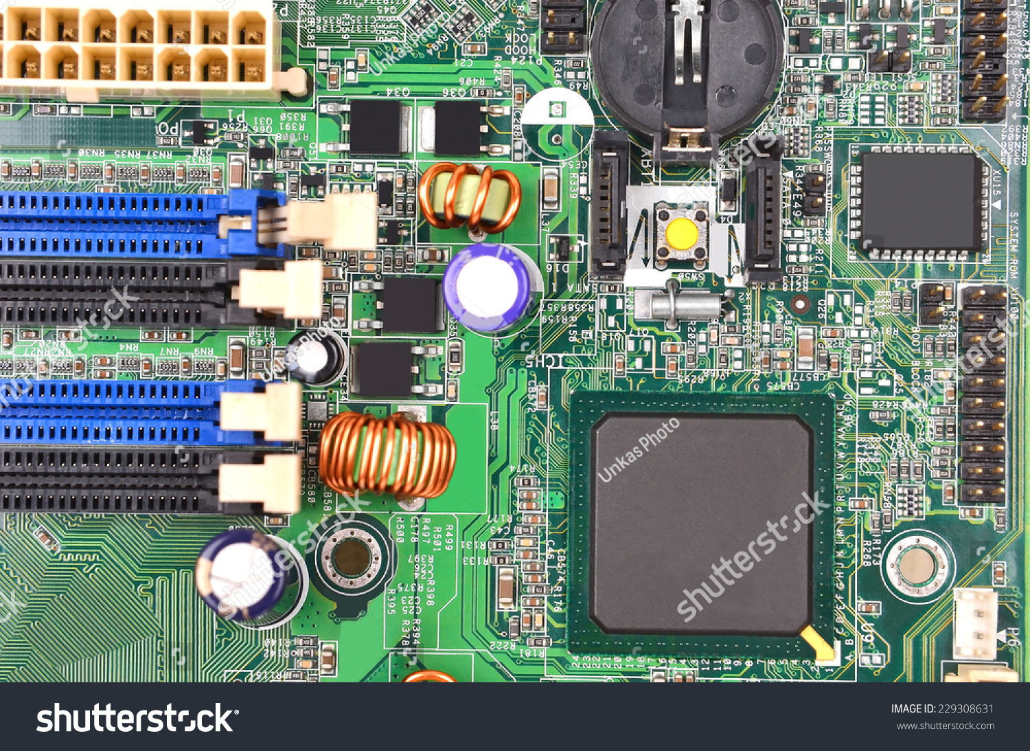 Printed computer motherboard with microcircuit, close up #229308631