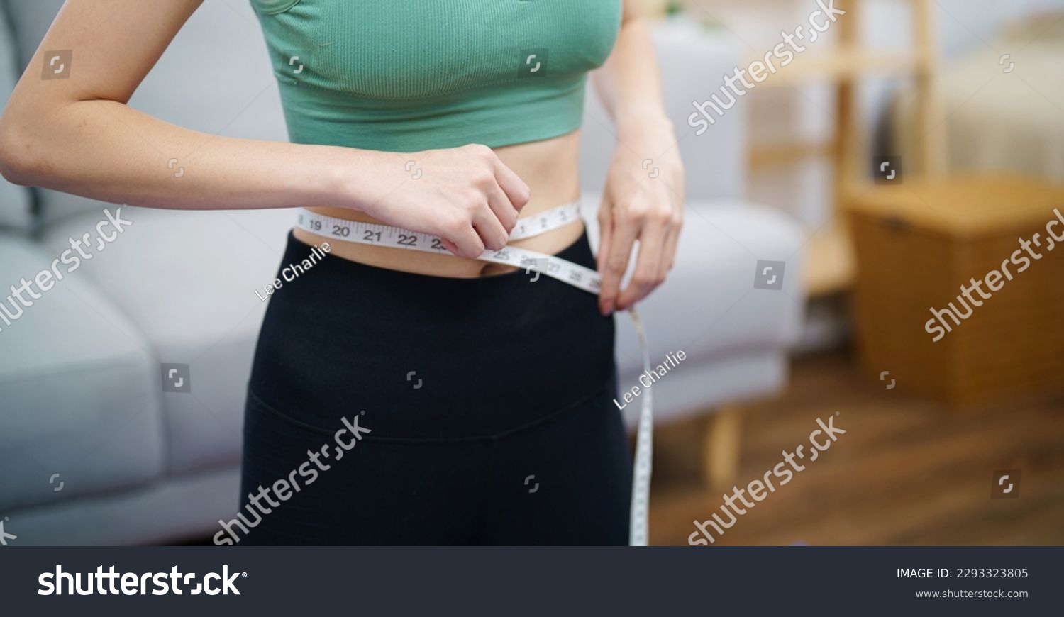 Asian woman with anorexia  with measuring tape feeling unhappy. Anorexia problem body perception and dysmorphia conceptใ #2293323805