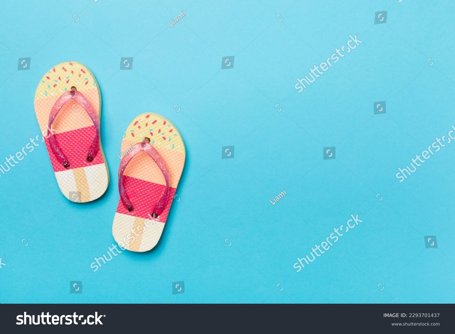 Bright flip flops on color background, top view #2293701437