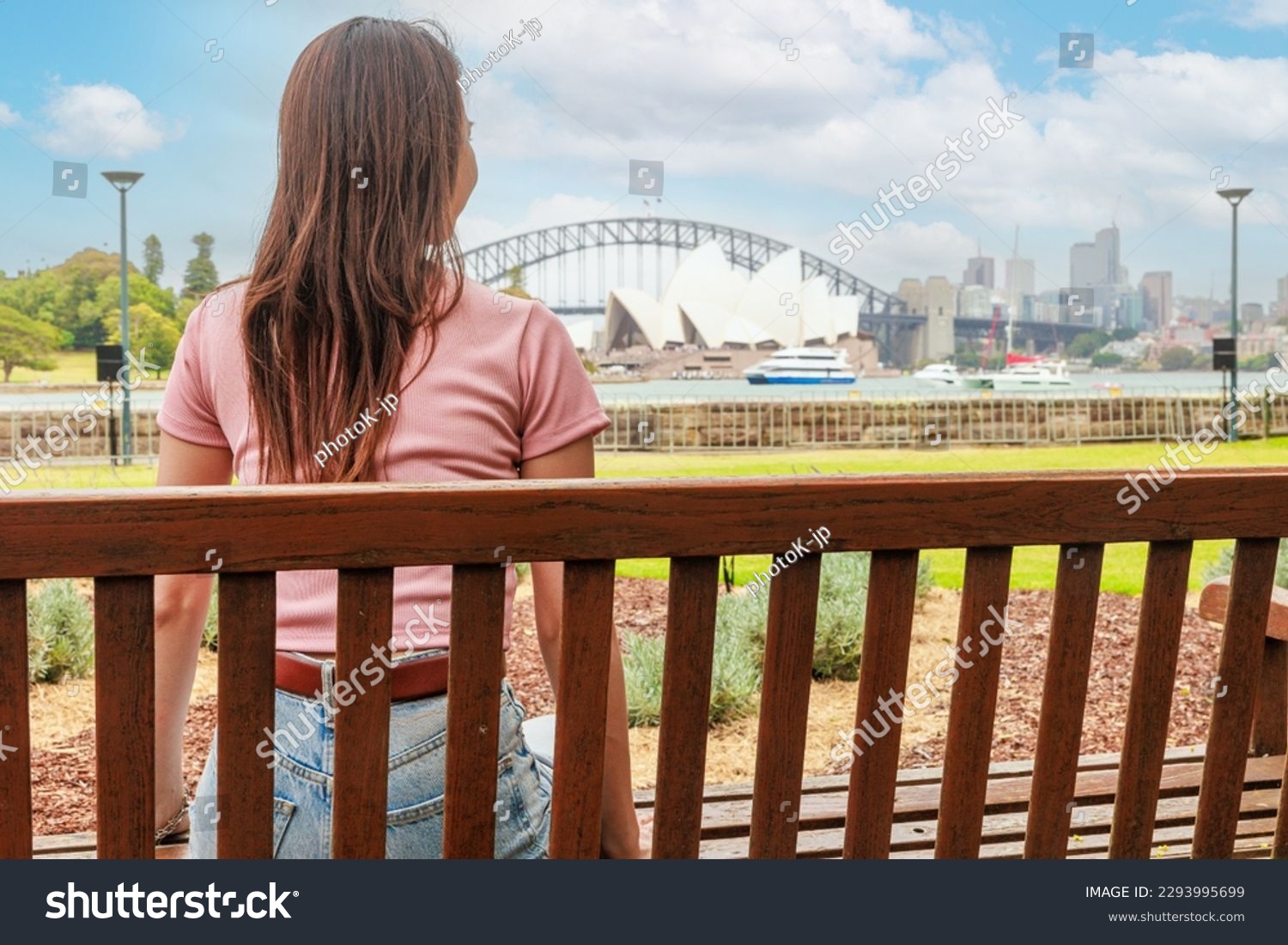 Rear view of a woman looking at the Sydney Opera House #2293995699