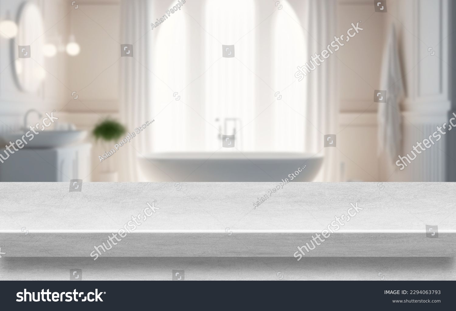 Marble table top with rest room bath tube blurry loose focal background.  Close up photo of contemporary interior #2294063793