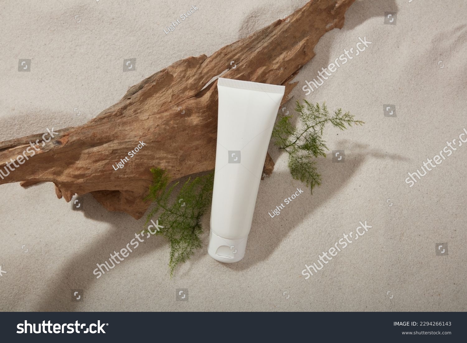 Mockup scene for cosmetic with white plastic bottle unbranded on sand texture background with dried twig and green leaves. Natural concept #2294266143