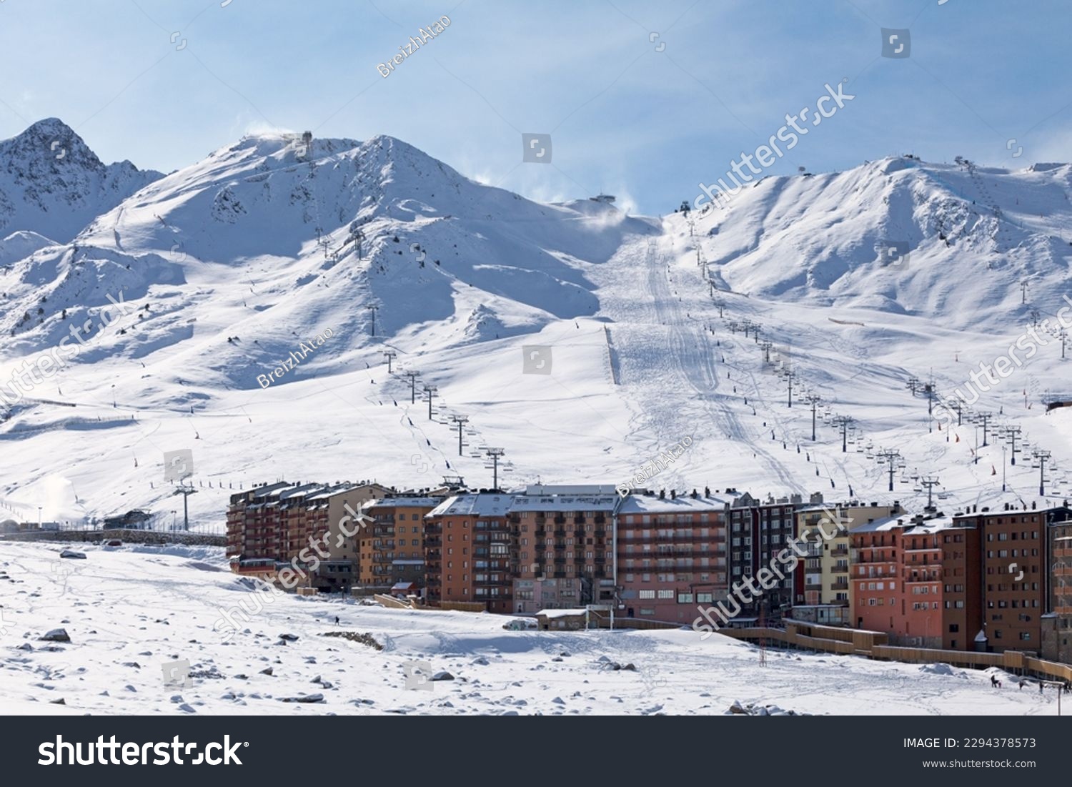 Ski lifts heading toward the top of the snow-capped mountains of Grandvalira from Pas de la Casa (Andorra). #2294378573