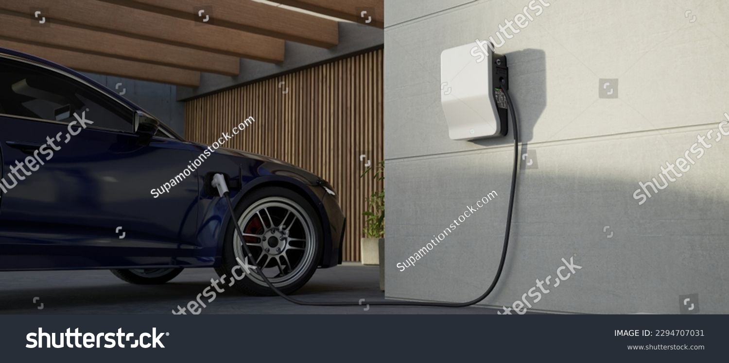 Generic electric vehicle EV hybrid car is being charged from a wallbox on a contemporary modern residential building house #2294707031