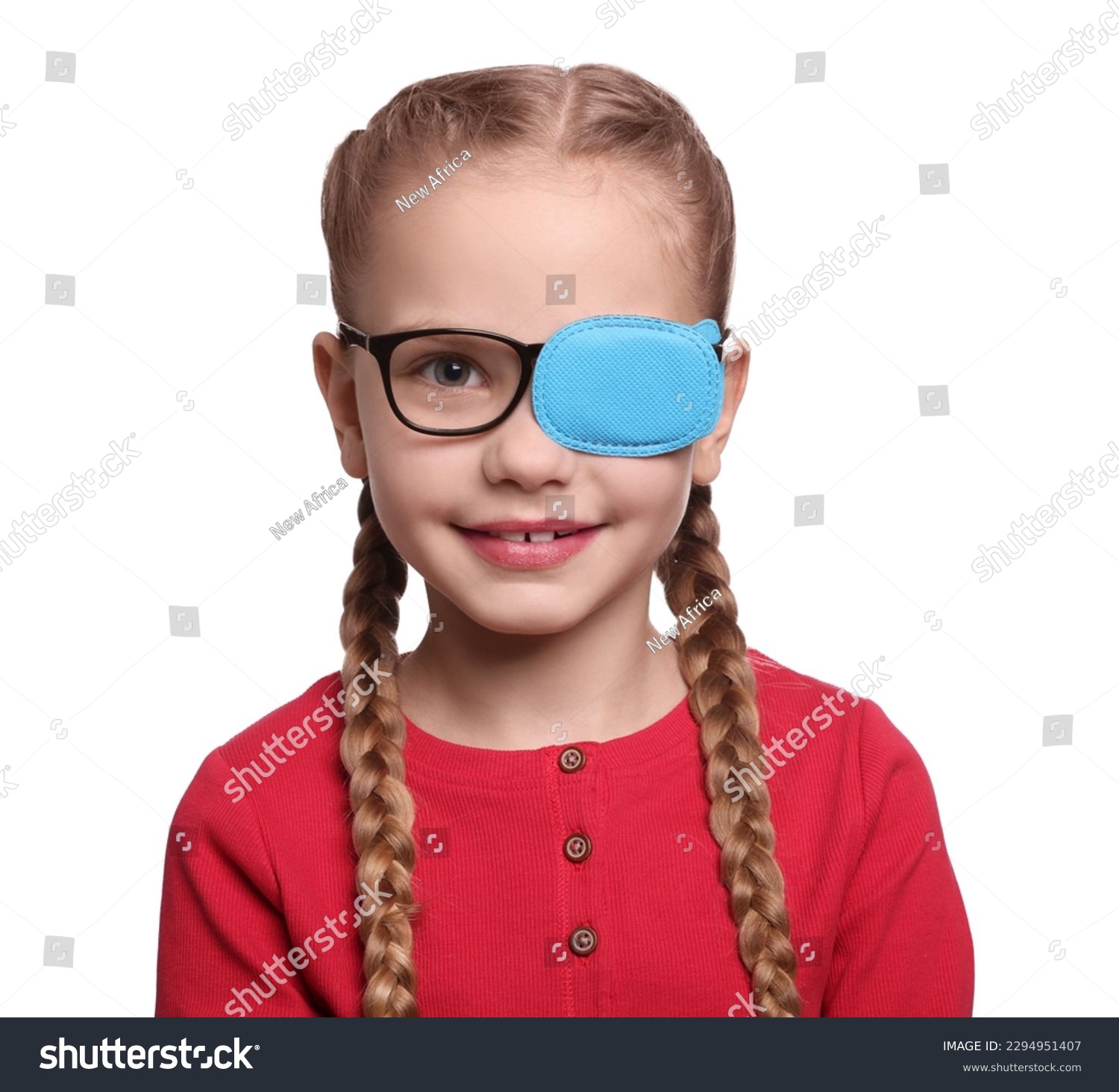 Happy girl with eye patch on glasses against white background. Strabismus treatment #2294951407