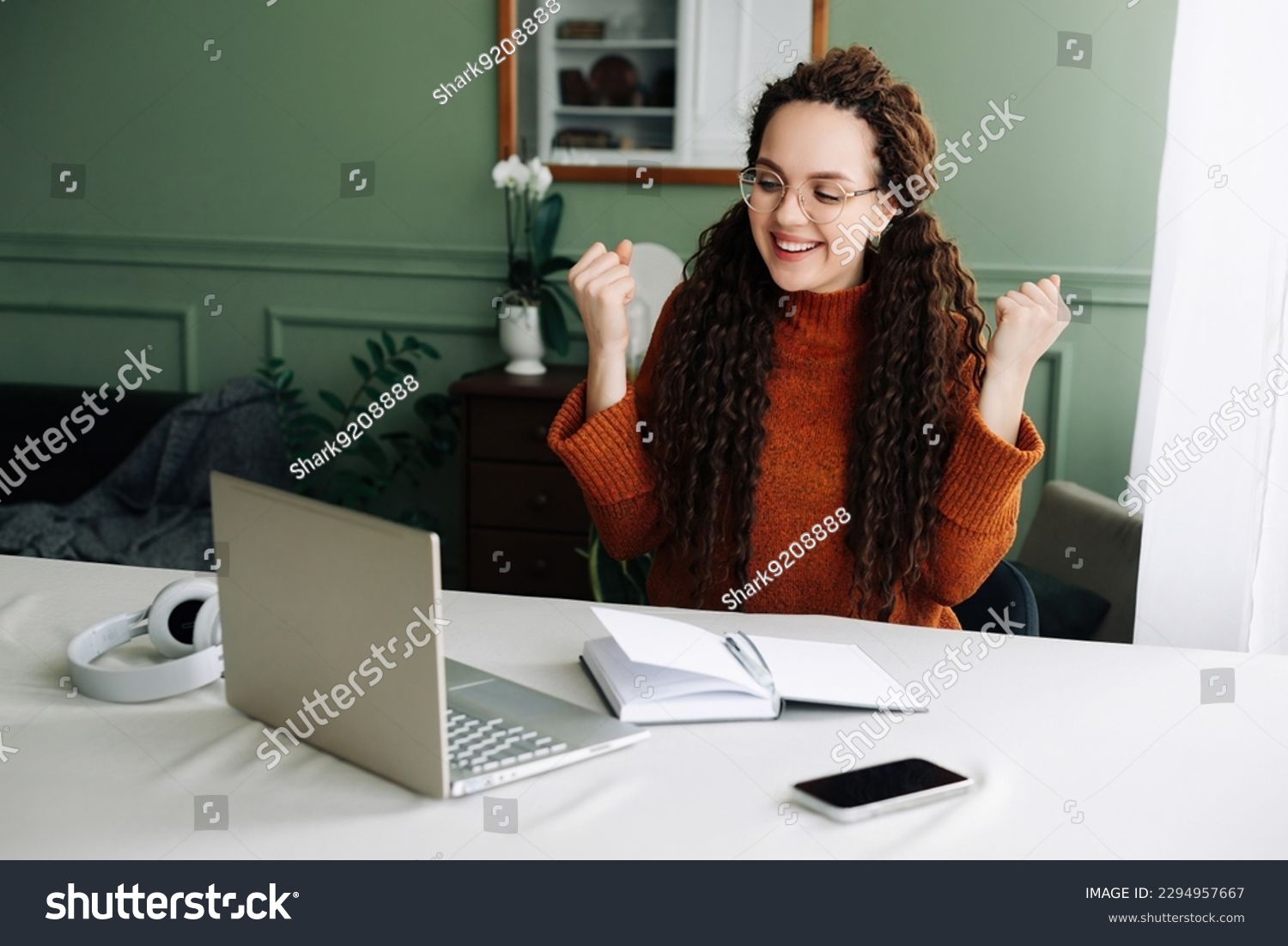 Happy Woman Winning Online: Receiving Good News via Email on Laptop. Excited Student Celebrating Success on Laptop Job Approval and Achievements Triumphant Student Winning Job Approval Overjoyed Woman #2294957667