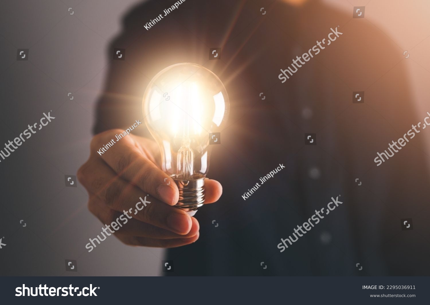 Business man holding light bulb. New idea, innovation technology and creative concept. #2295036911