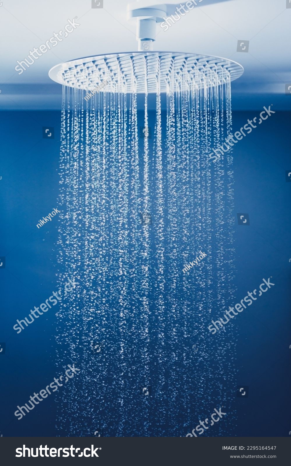 water drops falling from large rain shower head #2295164547