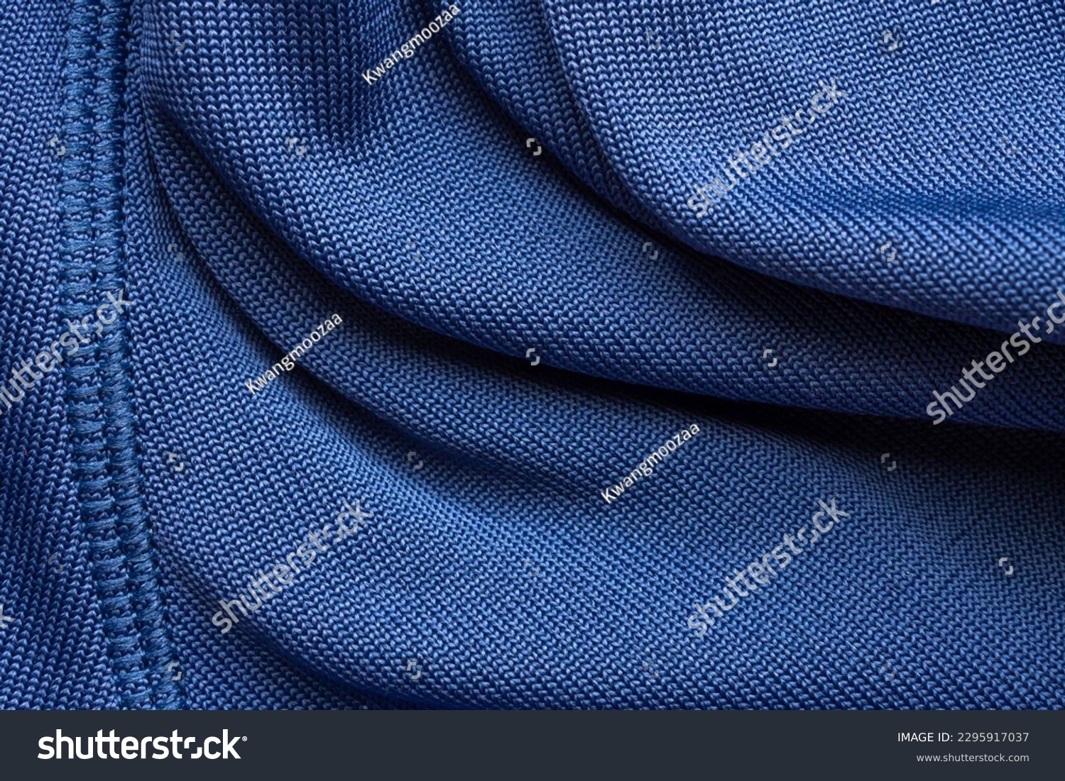 Blue sports clothing fabric football shirt jersey texture with stitches #2295917037