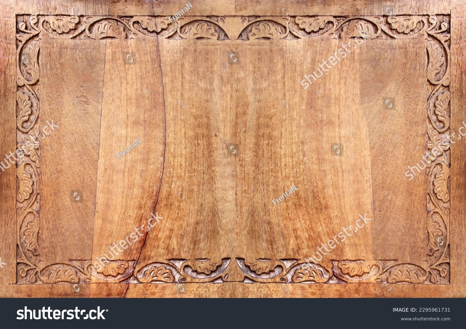 Horizontal background with wood carving floral ornament. Decorative carved border on wooden surface. Mock up template. Copy space for text #2295961731