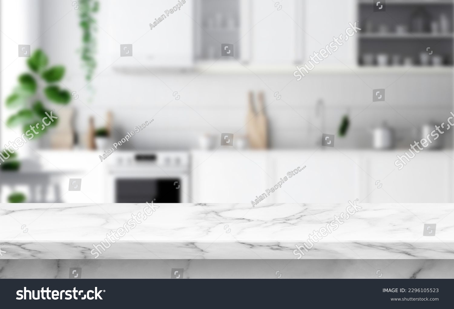 Close up photo of contemporary kitchen island with marble table top with kitchen blurry loose focal background #2296105523