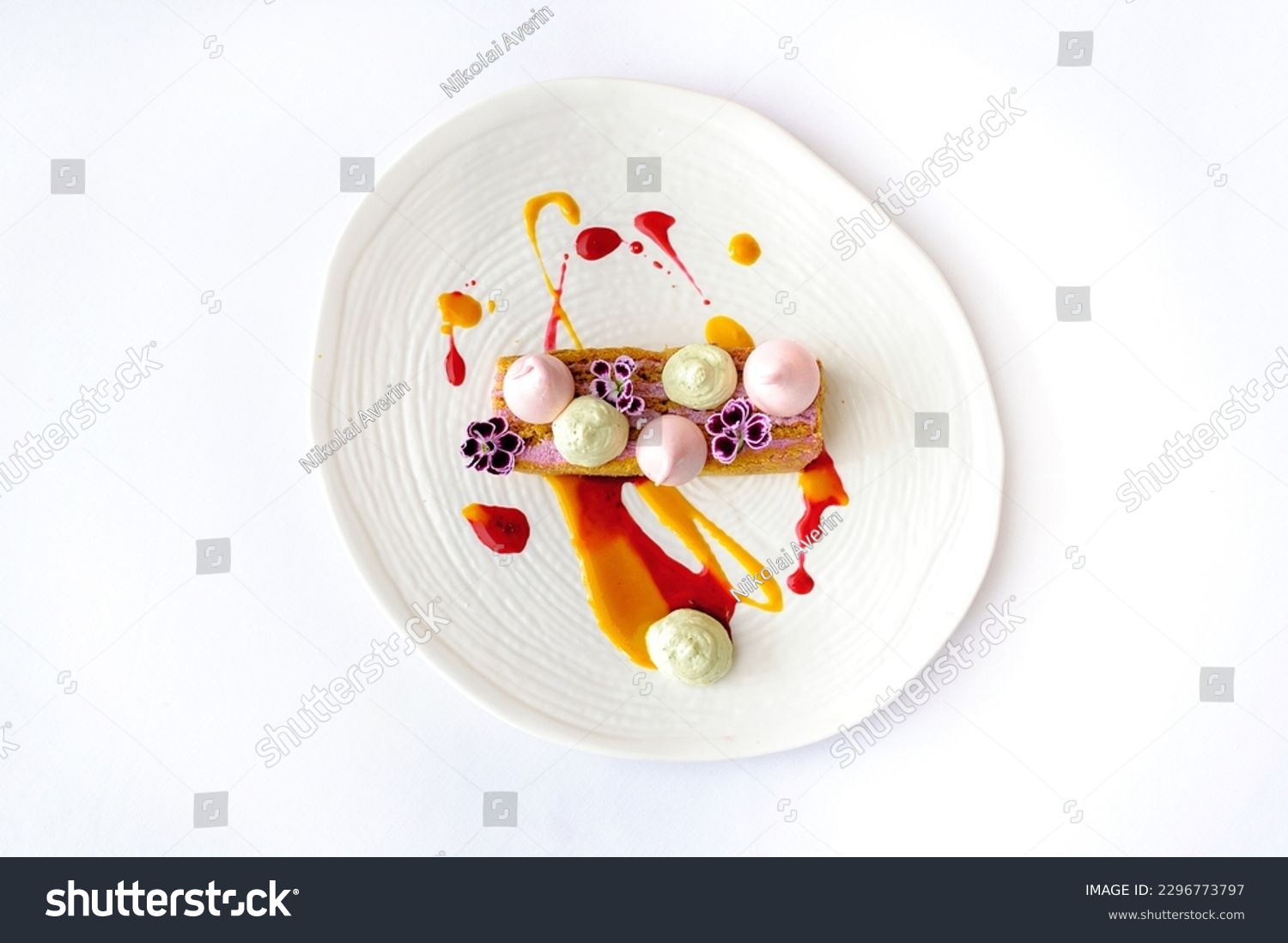 Carrot cake with berry mousse on a white plate isolated #2296773797