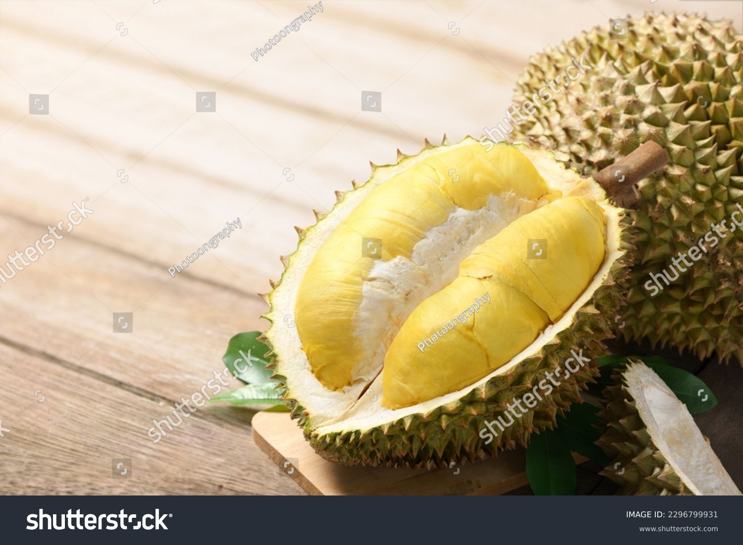 Durian fruit with cut in half on wooden table. #2296799931