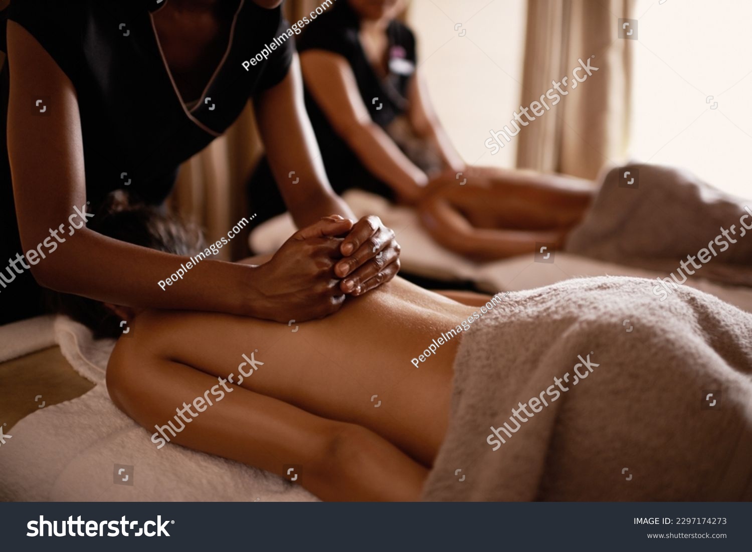 Hands, back massage and woman in spa with luxury service for muscle, body and relax with peace in resort. Masseuse, hospitality and physical therapy on bed for wellness, zen and healing in salon #2297174273