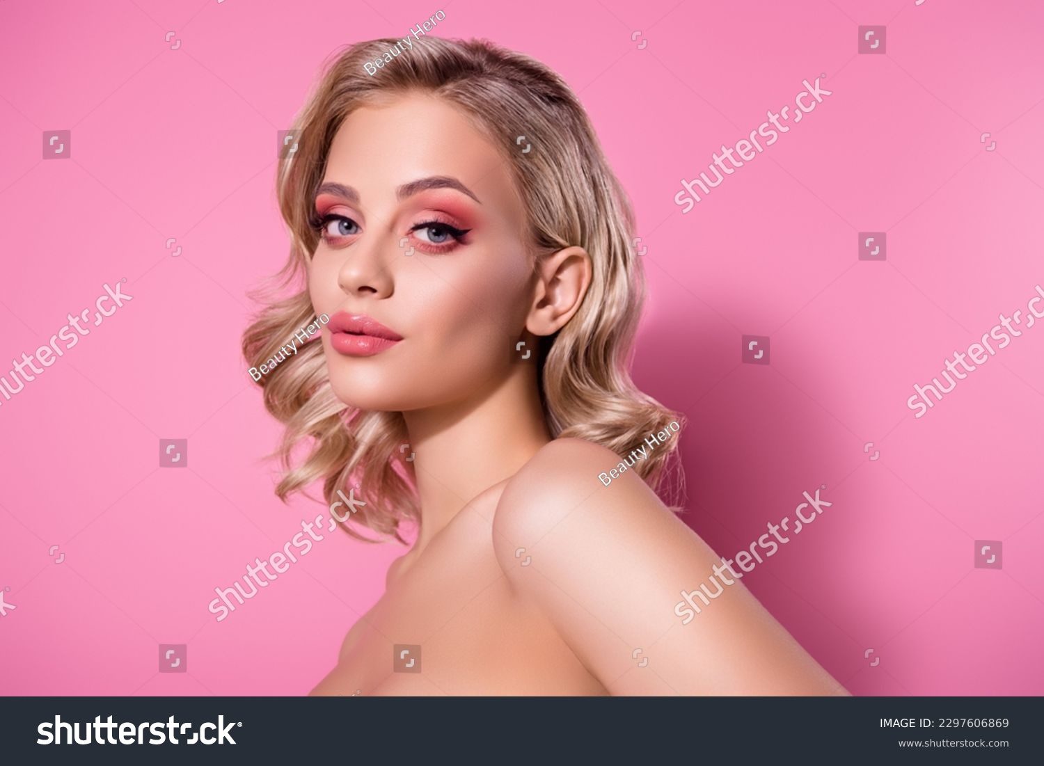 Portrait of attractive model girl studio portrait flawless body skin look camera posing isolated pink pastel background #2297606869