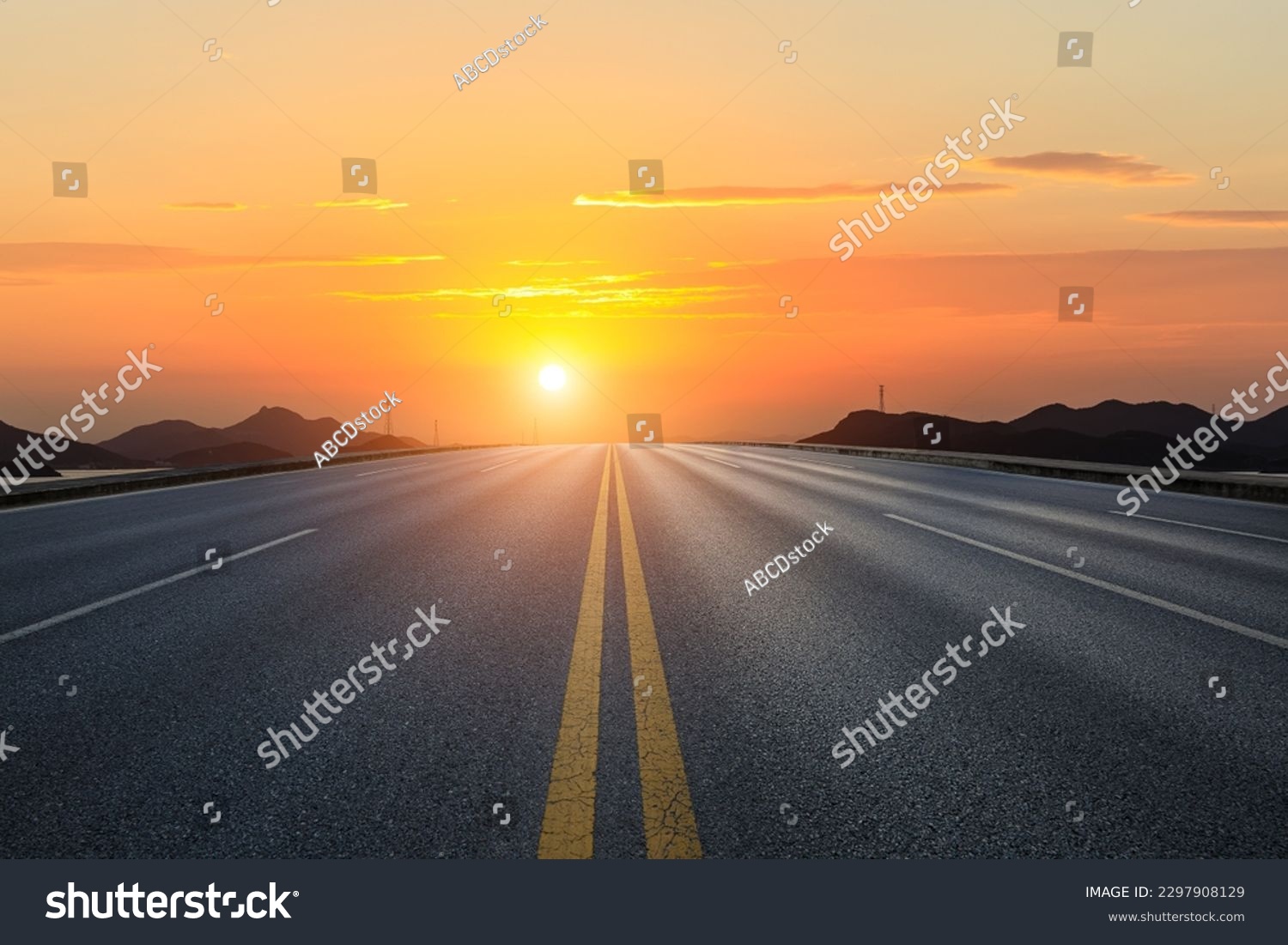 Straight asphalt road and mountain with sky clouds background at sunset #2297908129