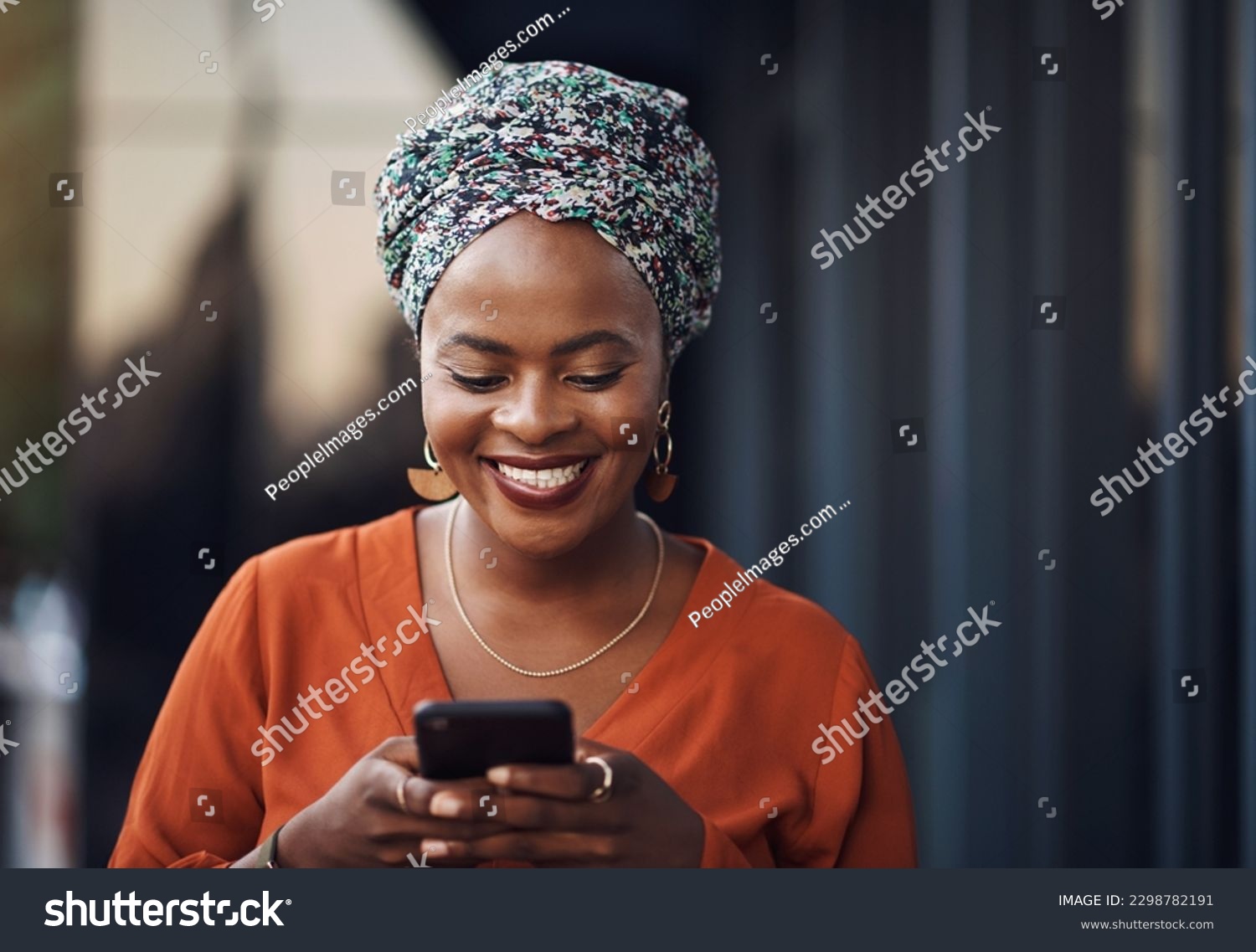 Black woman, happiness and phone text with online communication and networking. Happy, smile and female business employee on a mobile with social media and internet scroll reading a web message #2298782191