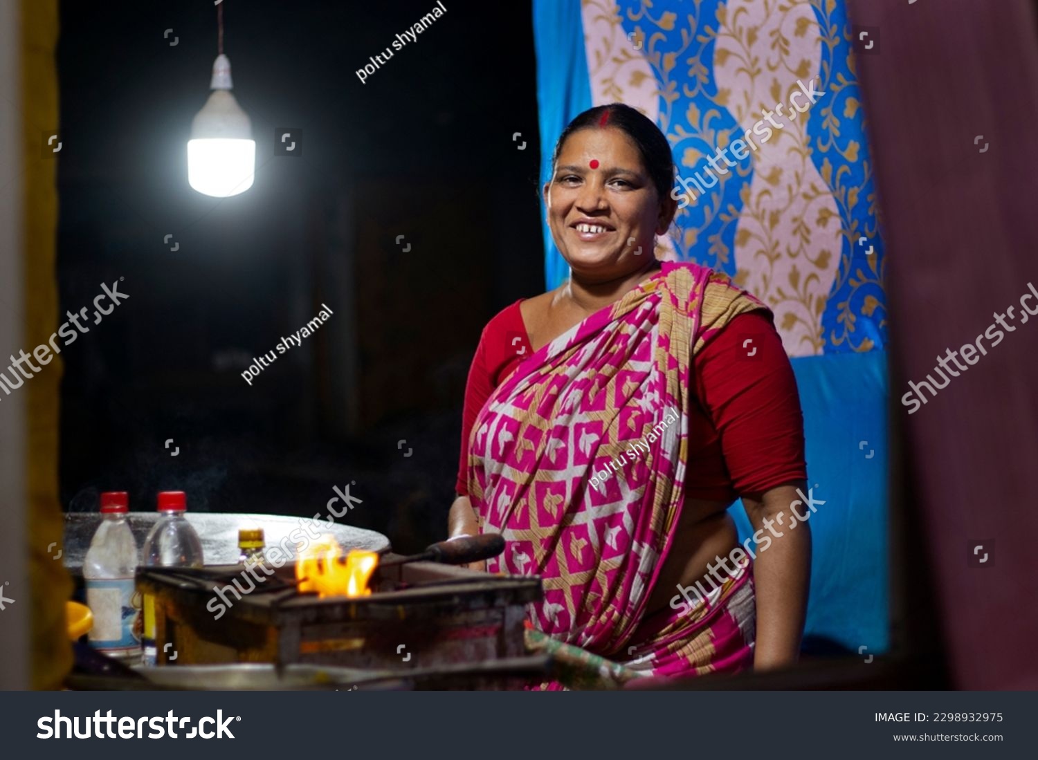 Smiling Rural indian woman standing in her shop #2298932975