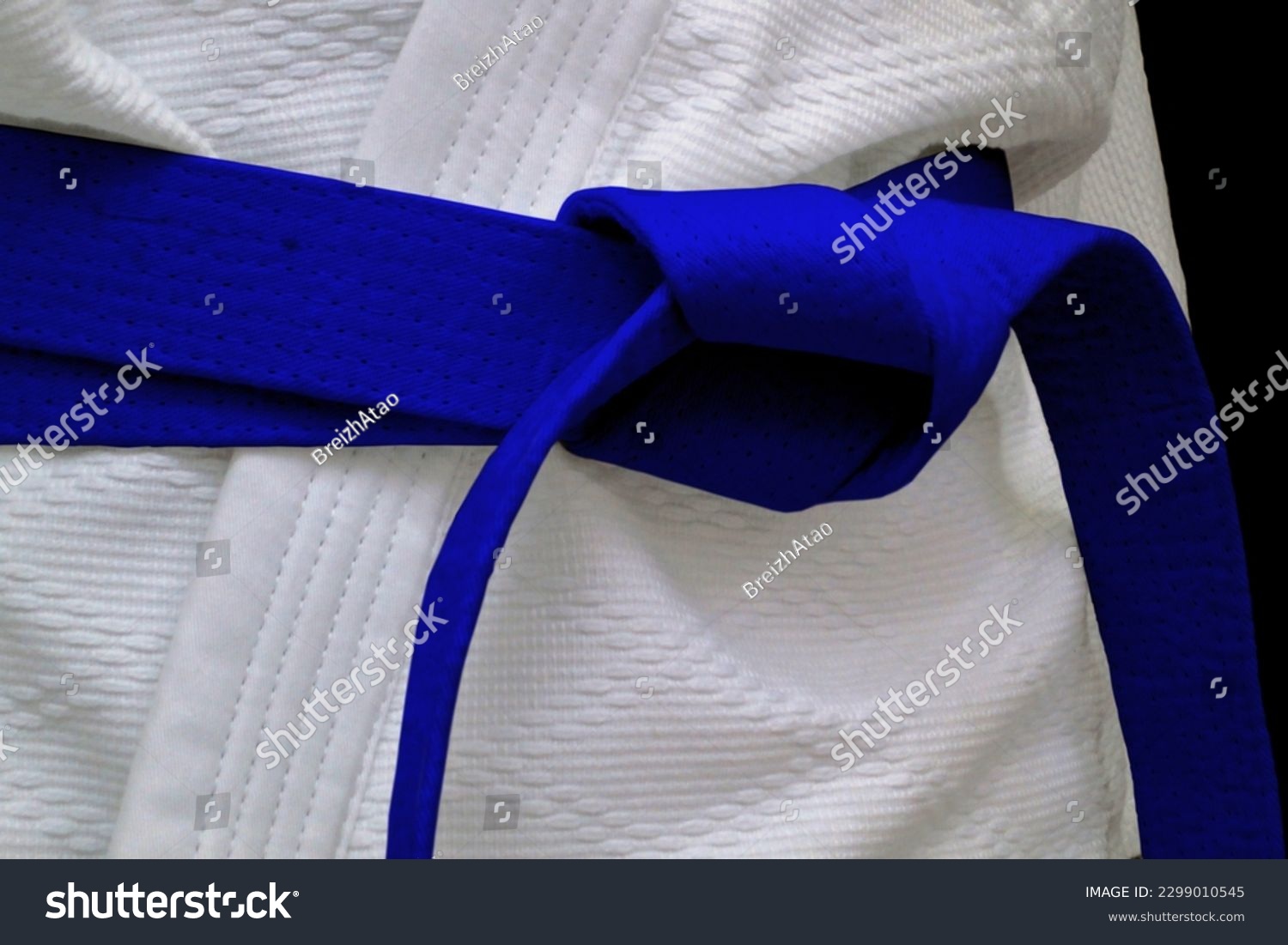 Close-up on a blue belt tied around a kimono. #2299010545