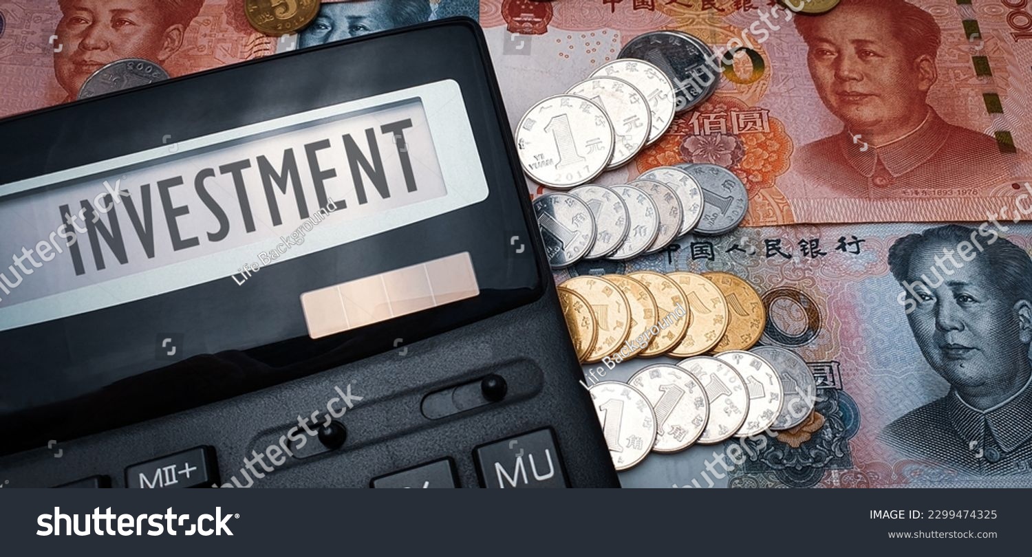 The word "investment" on calculator screen, Chinese currency and coins in the background. Illustration Chinese investment in global economy #2299474325