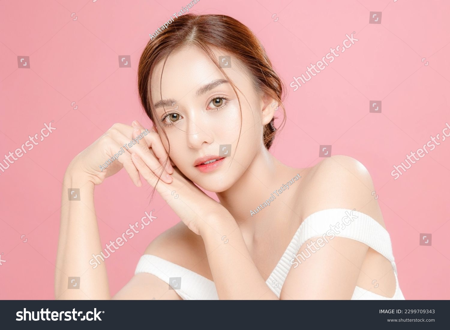 Young Asian beauty woman pulled back hair with korean makeup style on face and perfect skin on isolated pink background. Facial treatment, Cosmetology, plastic surgery. #2299709343