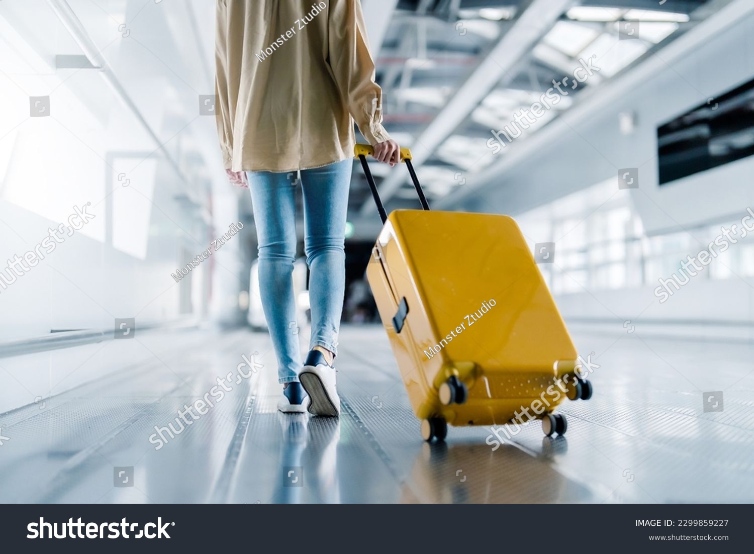 International airport terminal. Asian beautiful woman with luggage and walking in airport #2299859227
