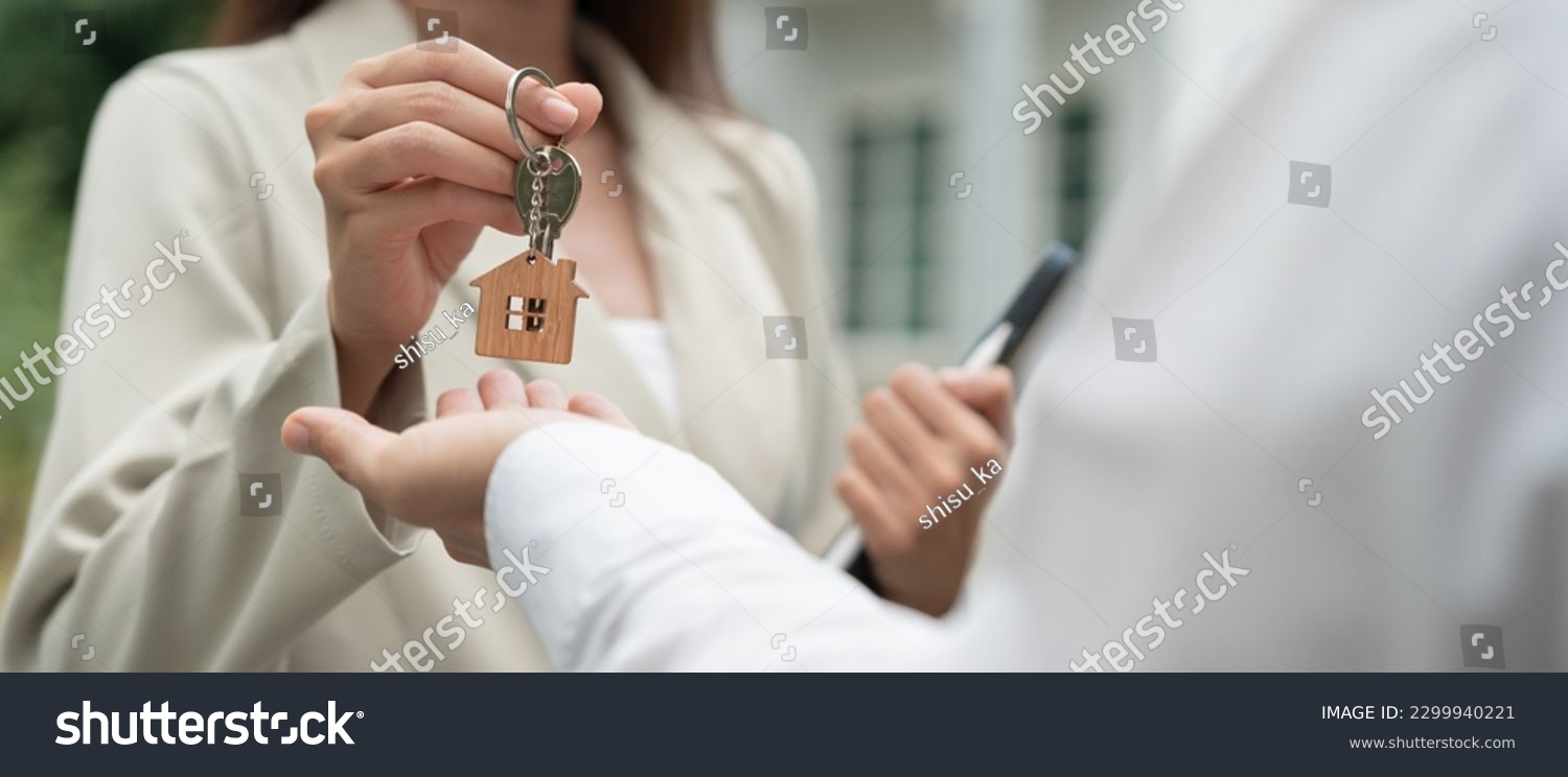 lease, rental and selling home. Real estate agent manager smile holding key for new owner.  rent house, Sales, loan credit financial, insurance, Seller, dealer, installment,  buy, sell, move in #2299940221