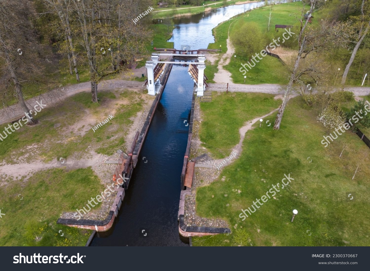 aerial view over dam lock sluice on lake impetuous waterfall #2300370667