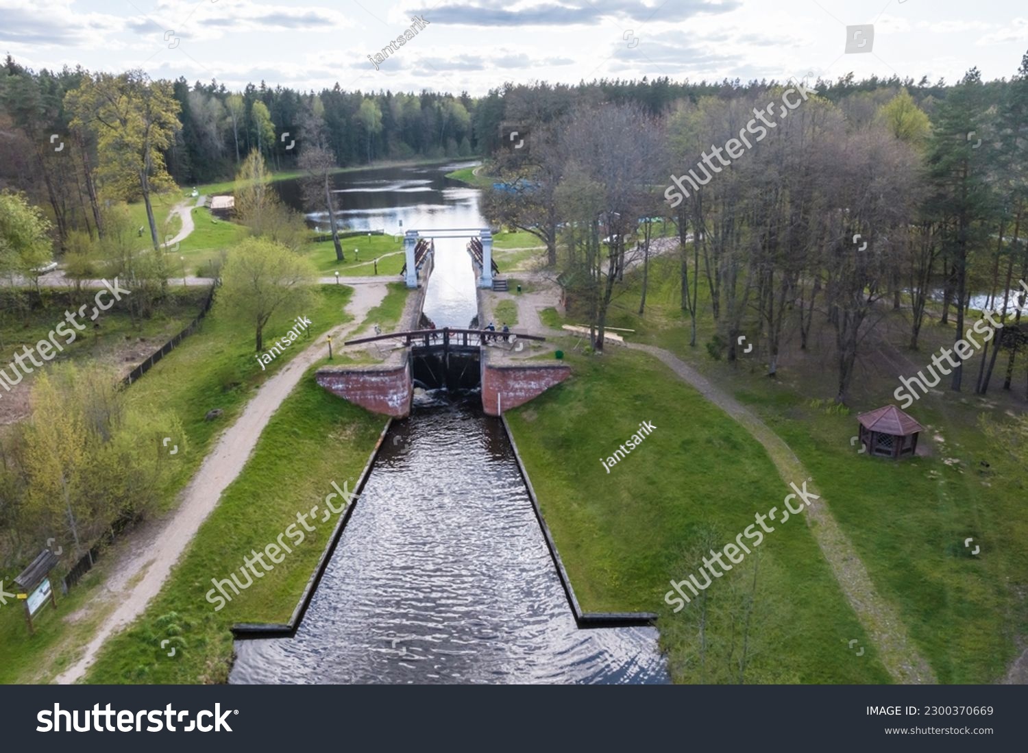 aerial view over dam lock sluice on lake impetuous waterfall #2300370669