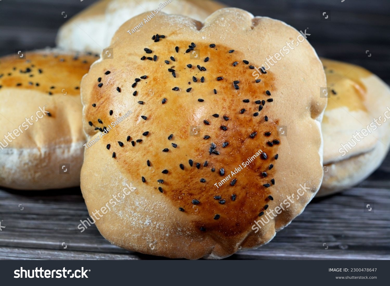 Egyptian Mahlab bread, puff thin, crispy and delicious with black seed baraka seeds on top, made of flour, dry yeast, milk, eggs, sugar, salt, black seeds, warm water, with anything or on its own #2300478647
