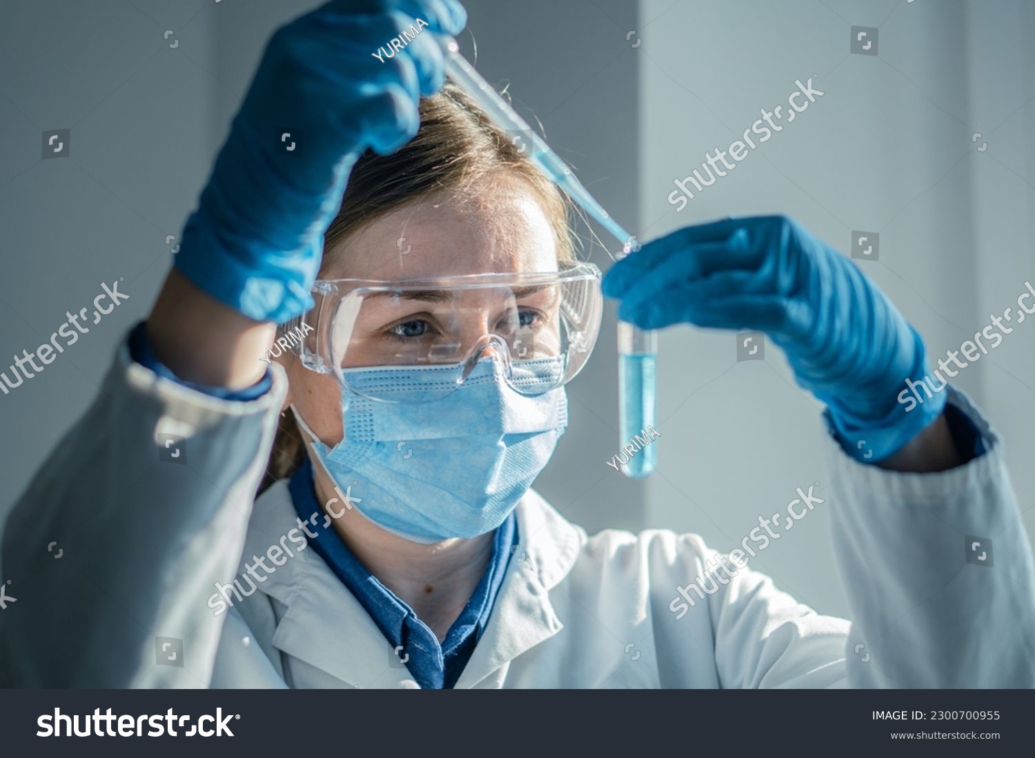 Photo shows chemist working on new technologies in a medical laboratory to improve diagnosis and treatment of diseases. Experiment in biological laboratory to determine effectiveness new medication. #2300700955