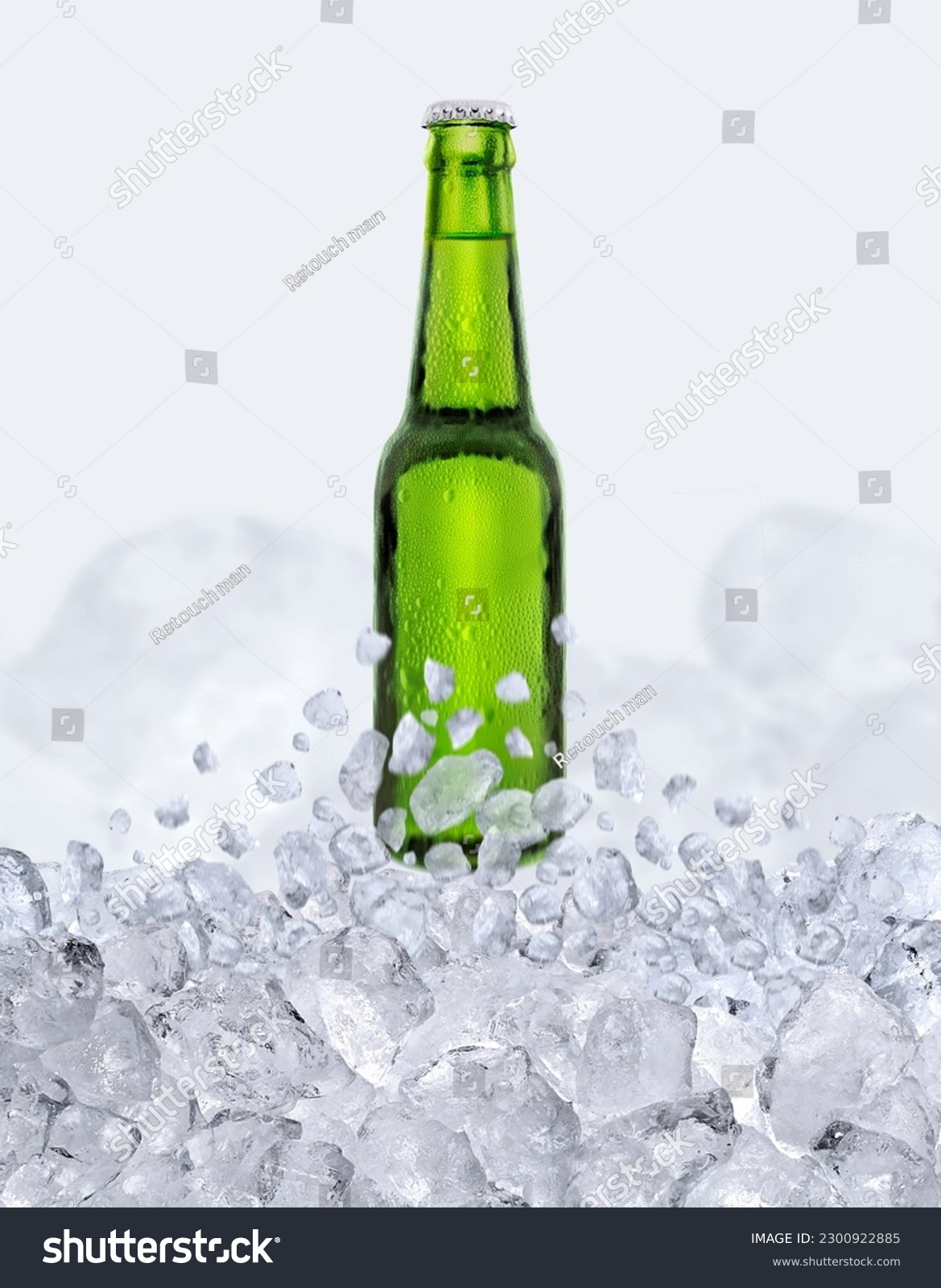 Green bottle of fresh beer with drops floats up through the ice cubes #2300922885