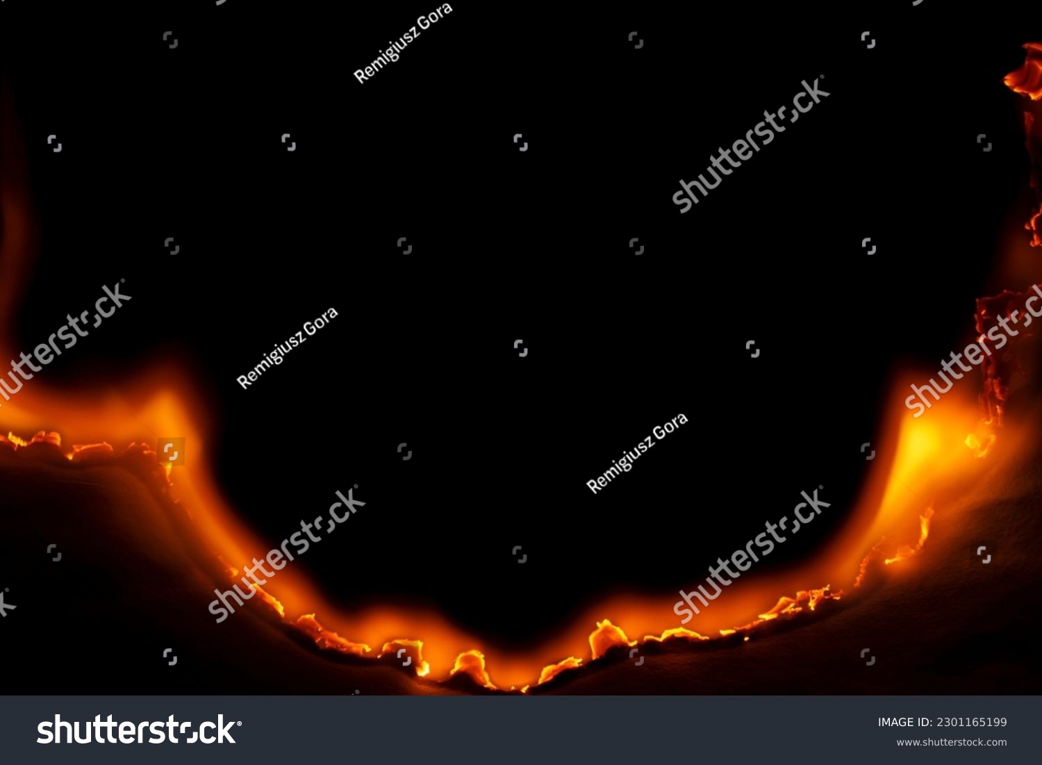 burning paper, glowing edge of paper on a black background #2301165199