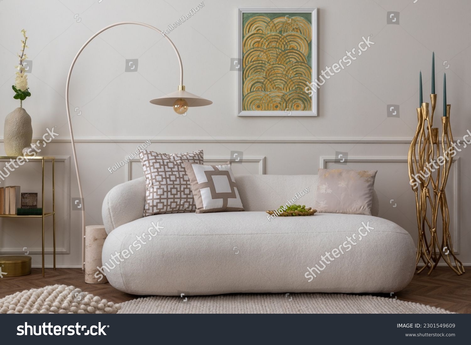 Cozy composition of living room interior with mock up poster frame, white sofa, green pillows, gold trace, plants, beige lamp, wall with stucco and personal accessories. Home decor. Template.  #2301549609