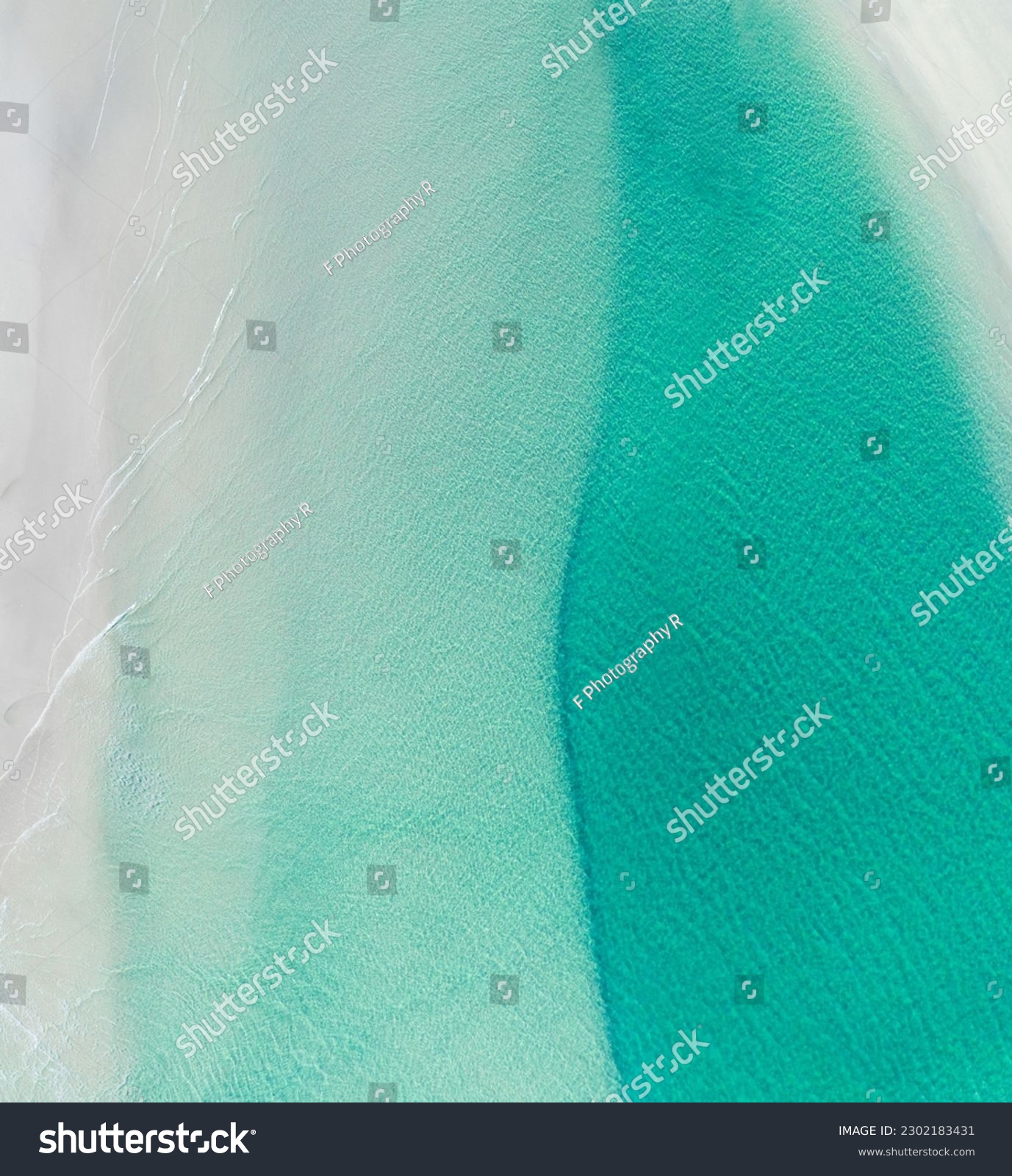 Aerial view of a beach with nice waves and shades of blues. Beautiful beach and scenes #2302183431