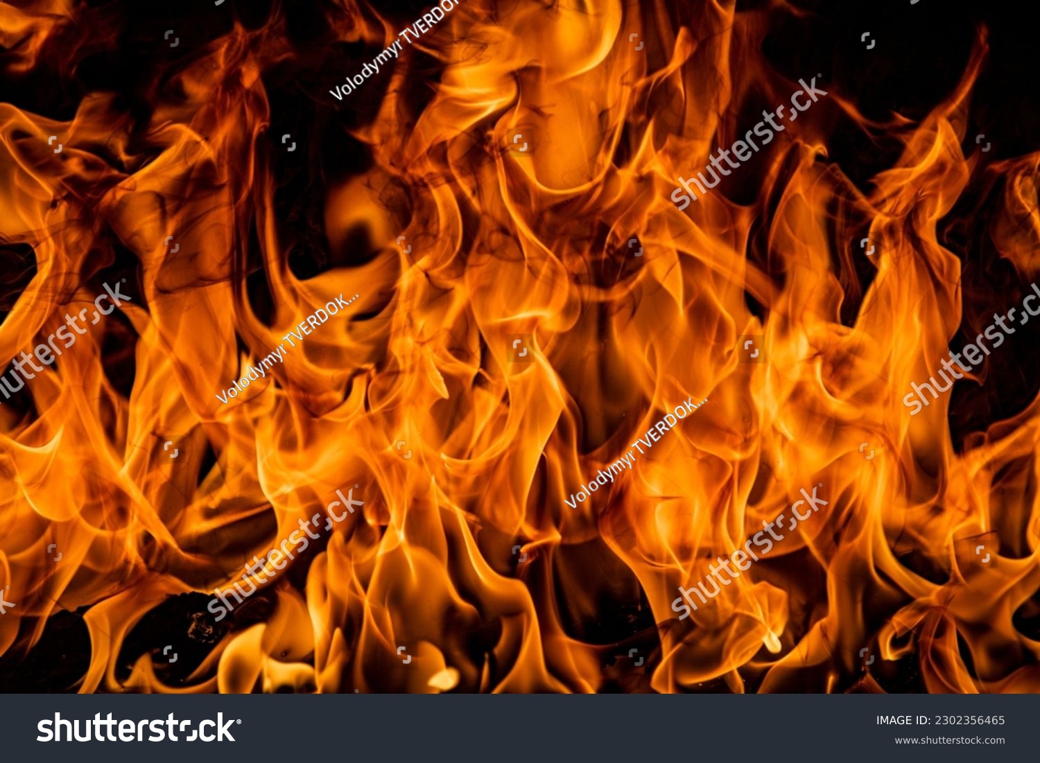 Fire blaze flames on black background. Fire burn flame isolated, abstract texture. Flaming explosion effect with burning fire. #2302356465