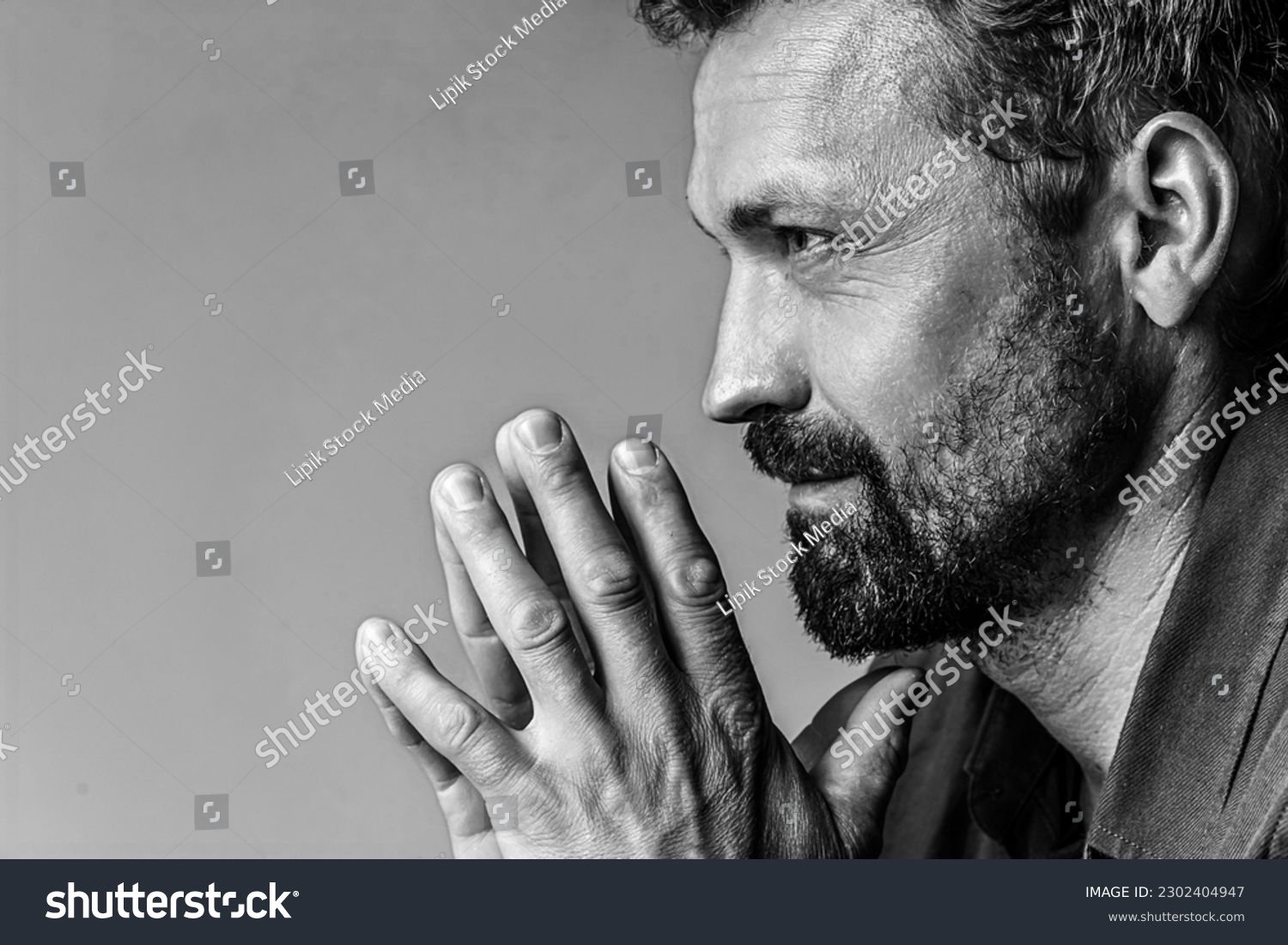 Man's brutal portrait in photo studio on white background in black and white colors. Handsome concept. High quality photo #2302404947