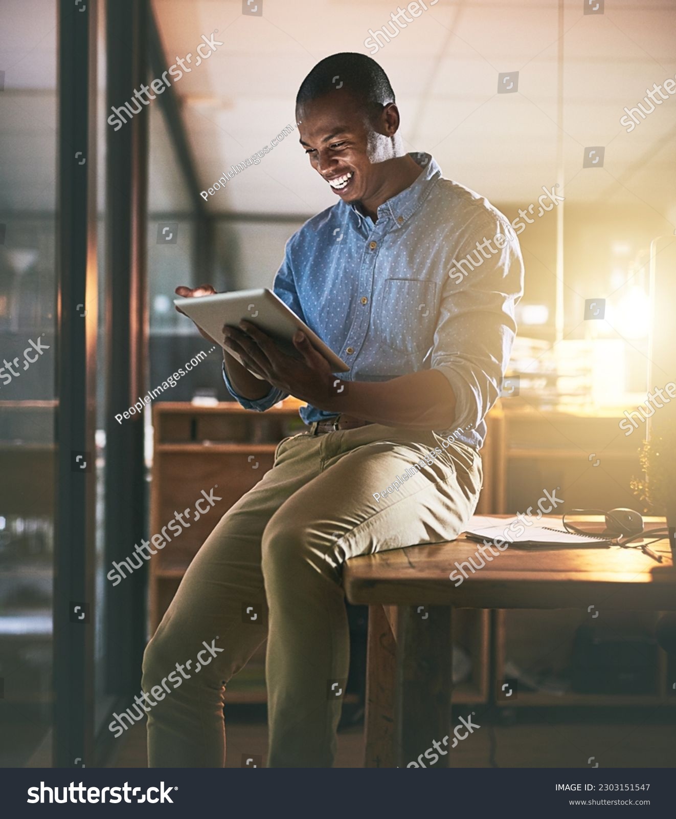 Business, smile and black man with a tablet, typing and online reading with software, modern office and happiness. Male person, employee or entrepreneur with technology, connection and communication #2303151547