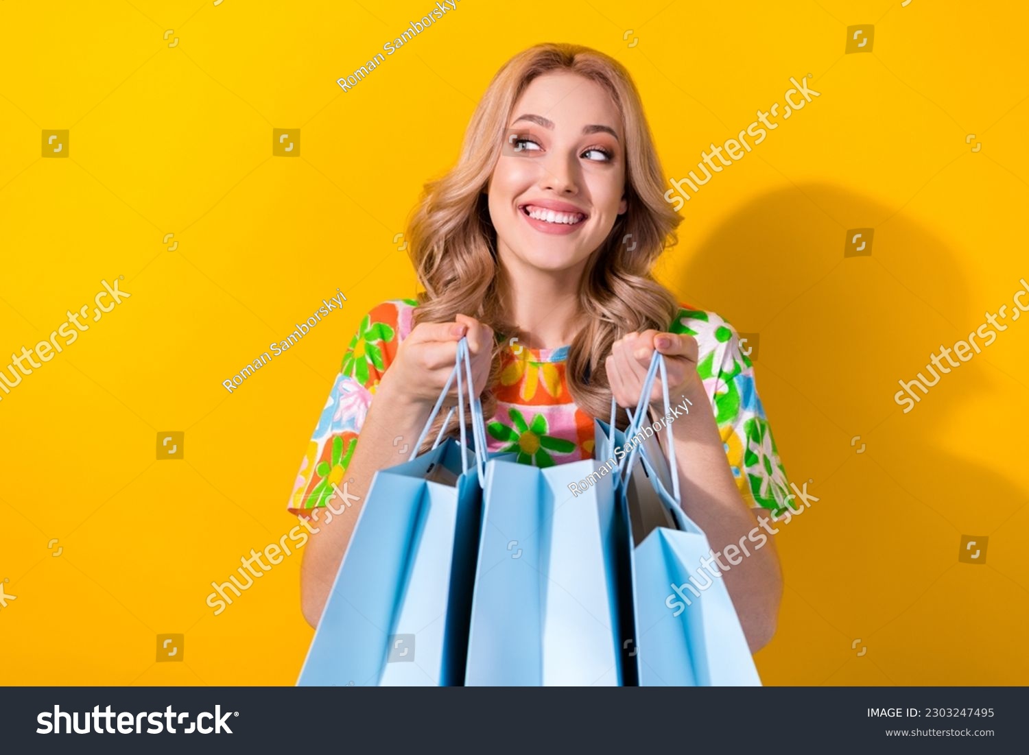 Photo of cute shopaholic lady hold many shopping packages read low prices poster wear shirt isolated yellow color background #2303247495